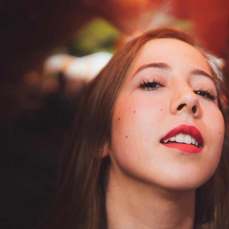 Asha Rao, Lead Design Curator at Parcel Bundle Crate, reviewing corporate floral arrangements